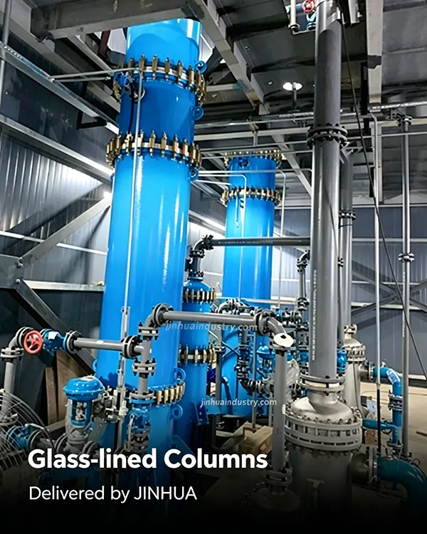 Tall glass-lined distillation columns and complex piping systems installed in a chemical plant by Jinhua Industry