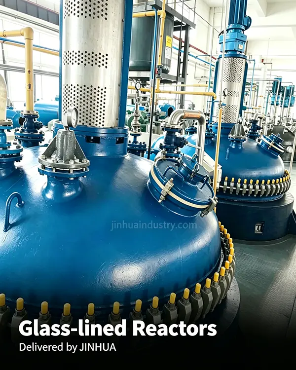 Row of large capacity heavy duty glass-lined chemical reactors installed in a polymer production plant